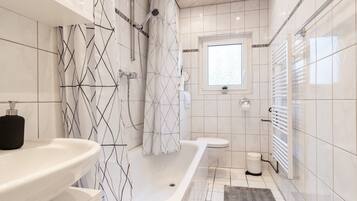 Combined shower/bathtub, hair dryer, towels, soap