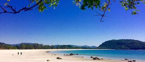 On the beach, white sand, beach towels