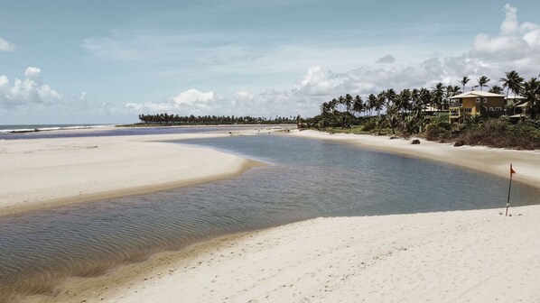 On the beach, sun-loungers, beach towels