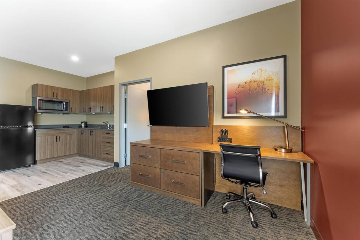 Suite, 1 King Bed, Non Smoking, Kitchenette (with Sofabed) | Desk, laptop workspace, iron/ironing board, WiFi (free)