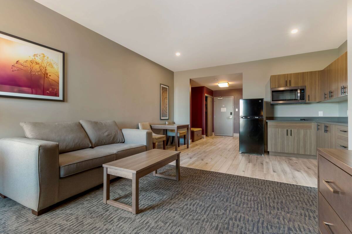 suite, 1 king bed, non smoking, kitchenette (with sofabed) | desk, laptop workspace, iron/ironing board, free wifi