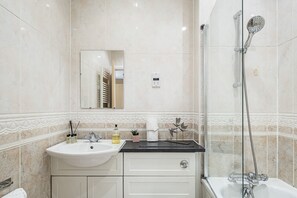 Apartment (First Floor) | Bathroom | Combined shower/bathtub, hair dryer, towels, soap