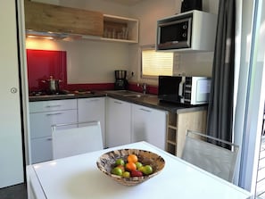 Fridge, microwave, stovetop, coffee/tea maker