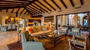 A spacious living area with a high ceiling, comfortable seating, and a view of the outdoor courtyard. - Luxury Holiday Villa near Main Attractions, San Jose del Cabo Villa 1019 (San José del Cabo)