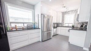 Family Room | Shared kitchen - Lux Host Ltd. (Winnipeg)