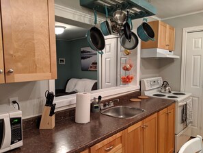 Microwave, coffee/tea maker, cookware/dishes/utensils