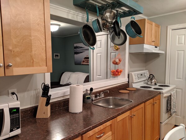 Microwave, coffee/tea maker, cookware/dishes/utensils