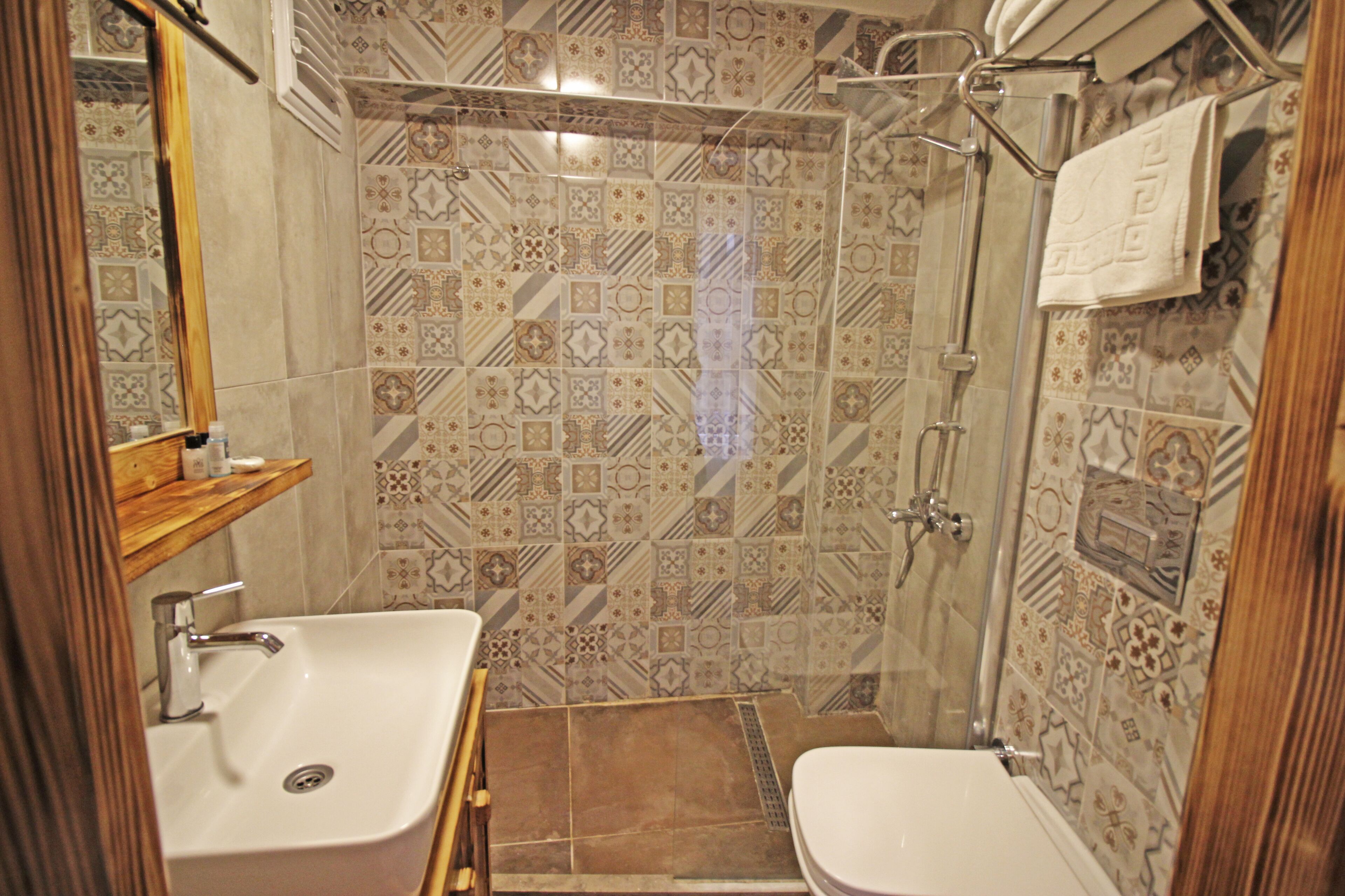 economy room, no windows | bathroom | shower, rainfall showerhead, hair dryer, towels