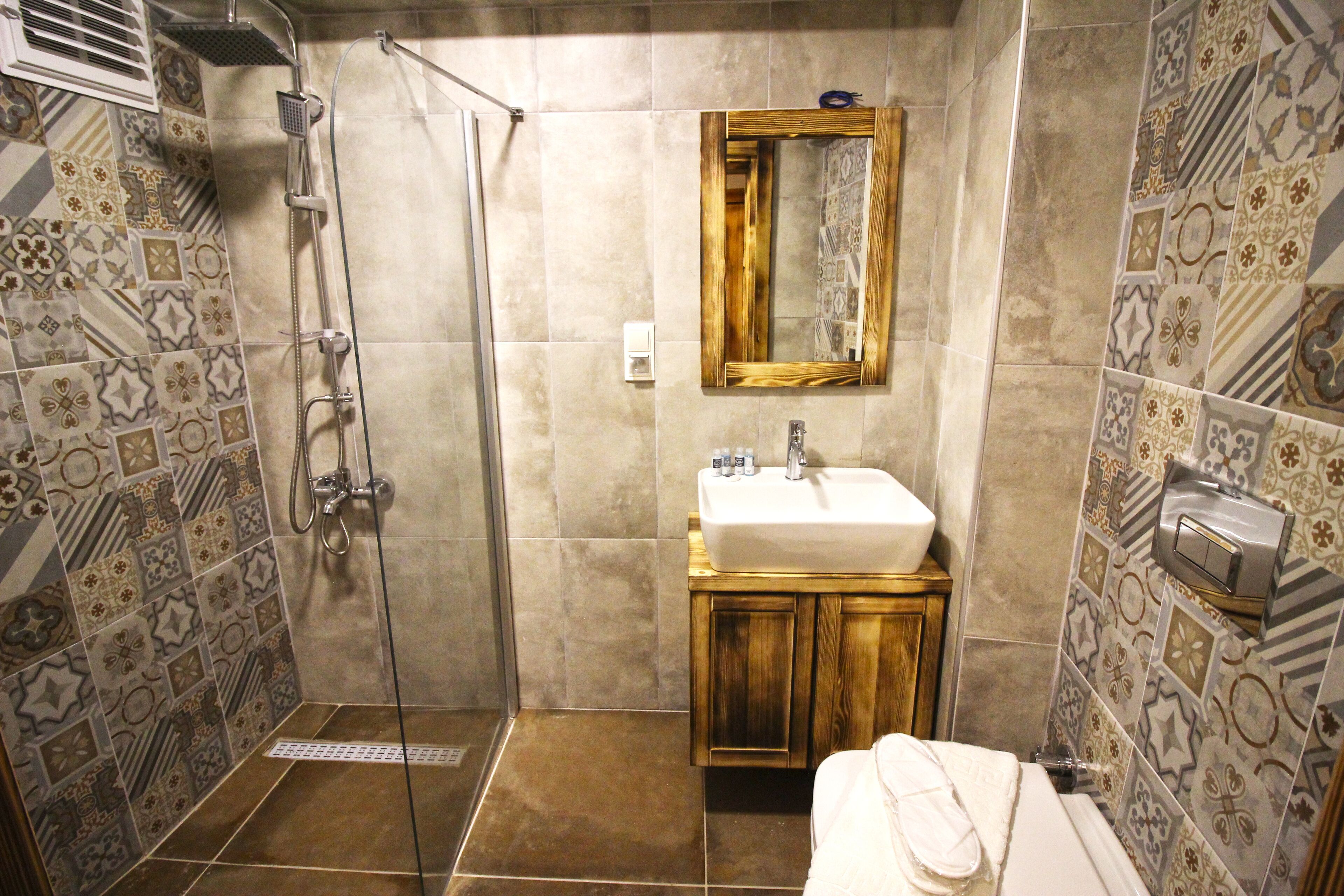 shower, rainfall showerhead, hair dryer, towels