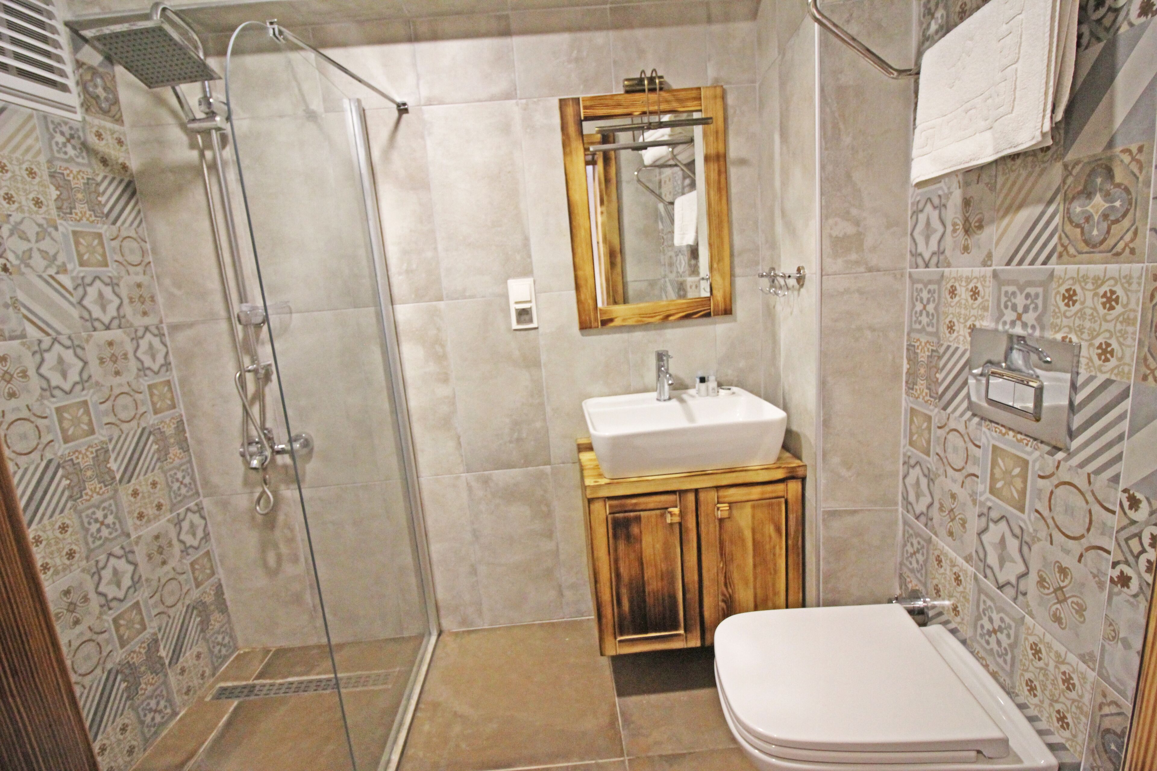 economy room, city view | bathroom | shower, rainfall showerhead, hair dryer, towels