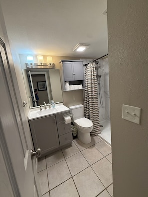 Combined shower/tub, hair dryer, towels, soap
