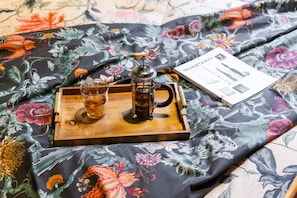 Enjoy a warm morning with a French press and a good book on our plush bed.
