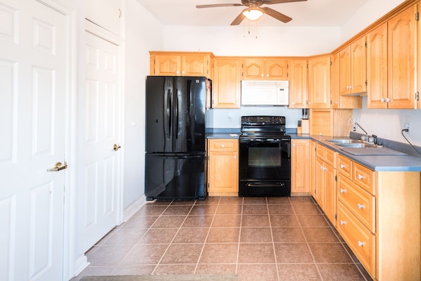 Fridge, microwave, oven, cookware/dishes/utensils