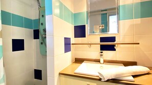 Shower, hair dryer, towels