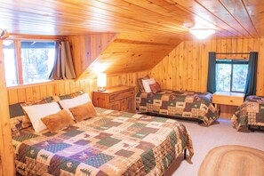 A cozy room with two beds, a nightstand, and a window. - Escape to Magical "Minikahda Lodge" on Clear Creek in Rhododendron (Rhododendron)