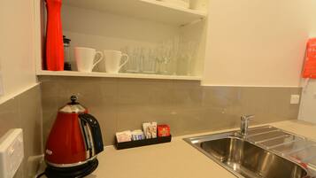 Deluxe Townhome | Private kitchenette | Fridge, microwave, electric kettle, toaster