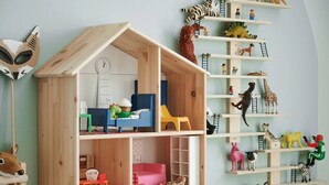 A dollhouse with a kitchen, living room, and bedroom, and a wall with shelves holding various animal figurines. - Kikusui Mark's apartment (Sapporo)