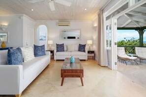 Apartment, 3 Bedrooms | Living area | 32-inch TV with cable channels