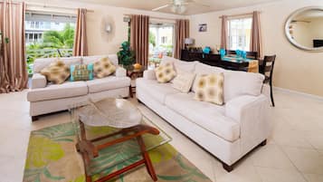 Apartment, 3 Bedrooms | Living area | 50-inch flat-screen TV with cable channels, TV