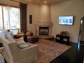 Smart TV, fireplace, books, offices