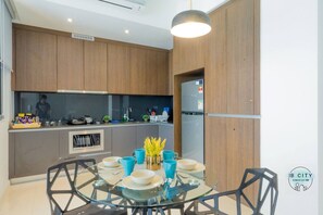 Fridge, cookware/dishes/utensils, spices, dining tables