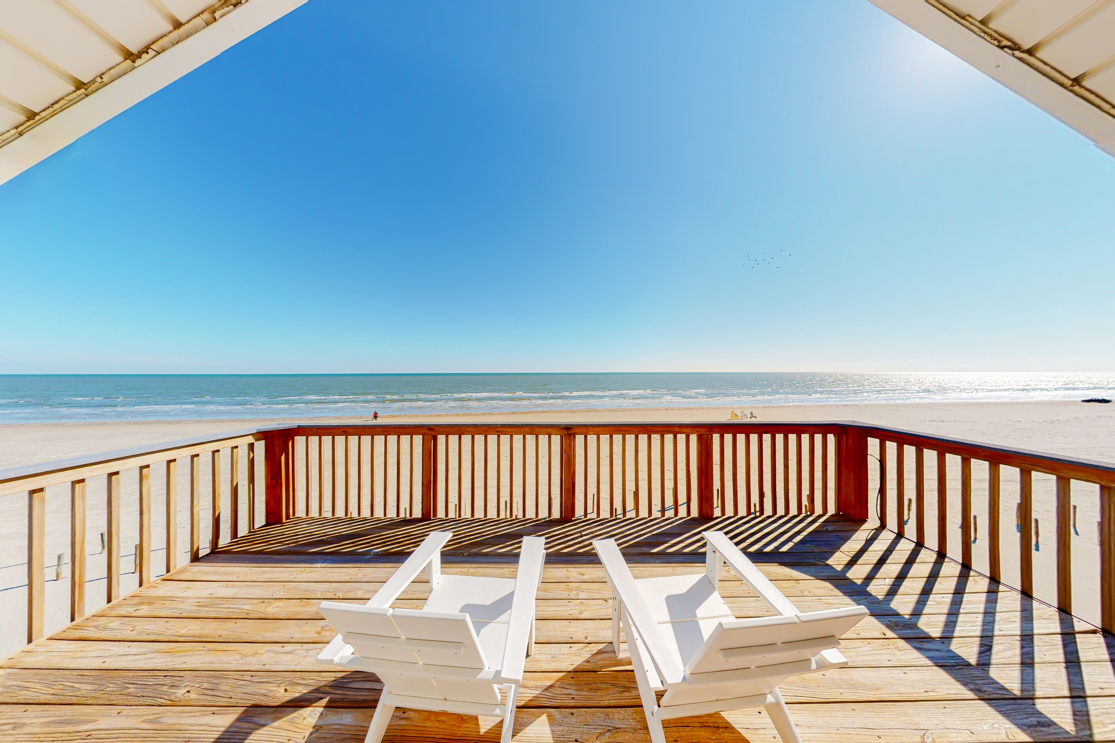 Beautiful beachfront home with coastal views, covered deck, & full kitchen