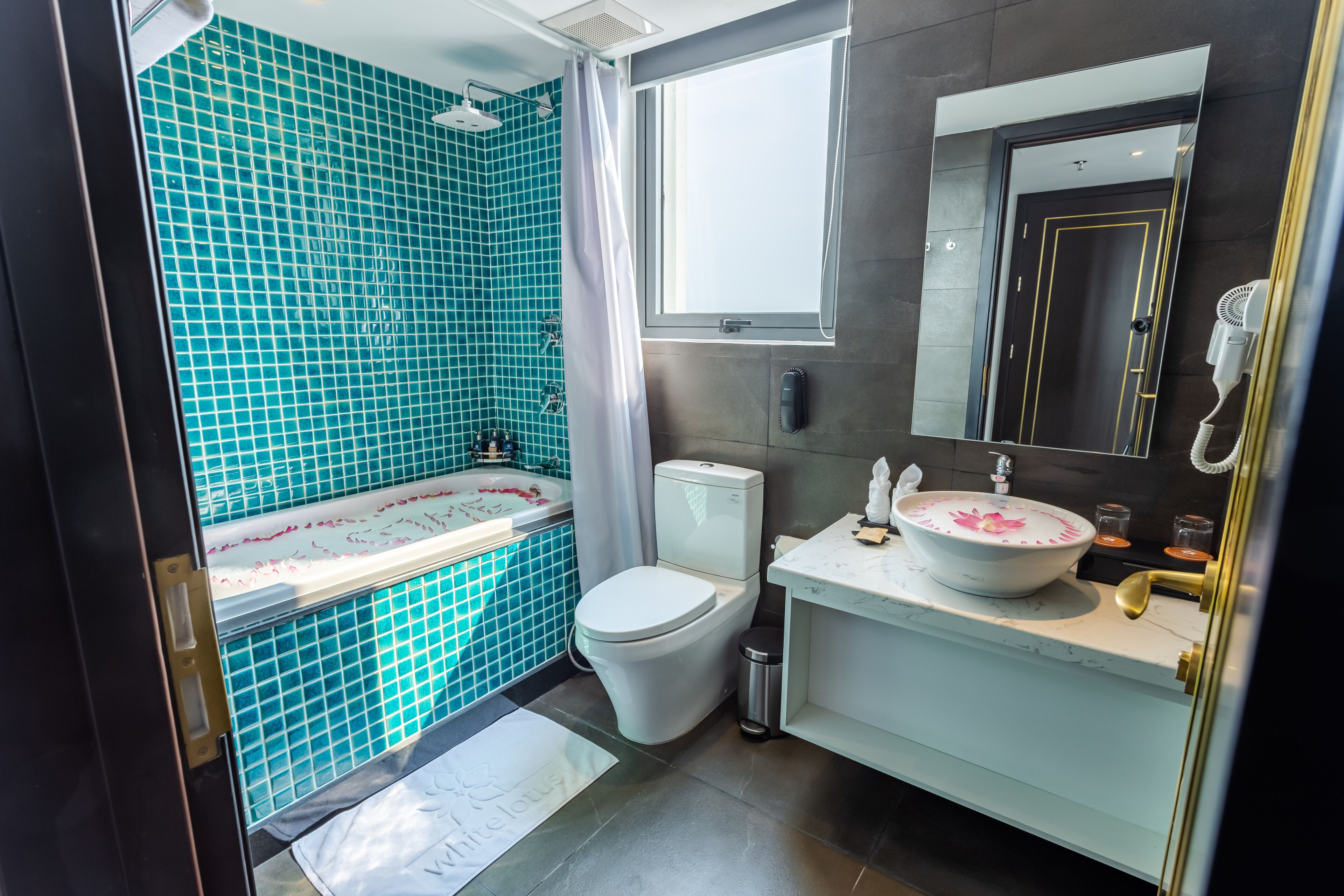 connecting double room river view | bathroom | free toiletries, hair dryer, slippers, towels