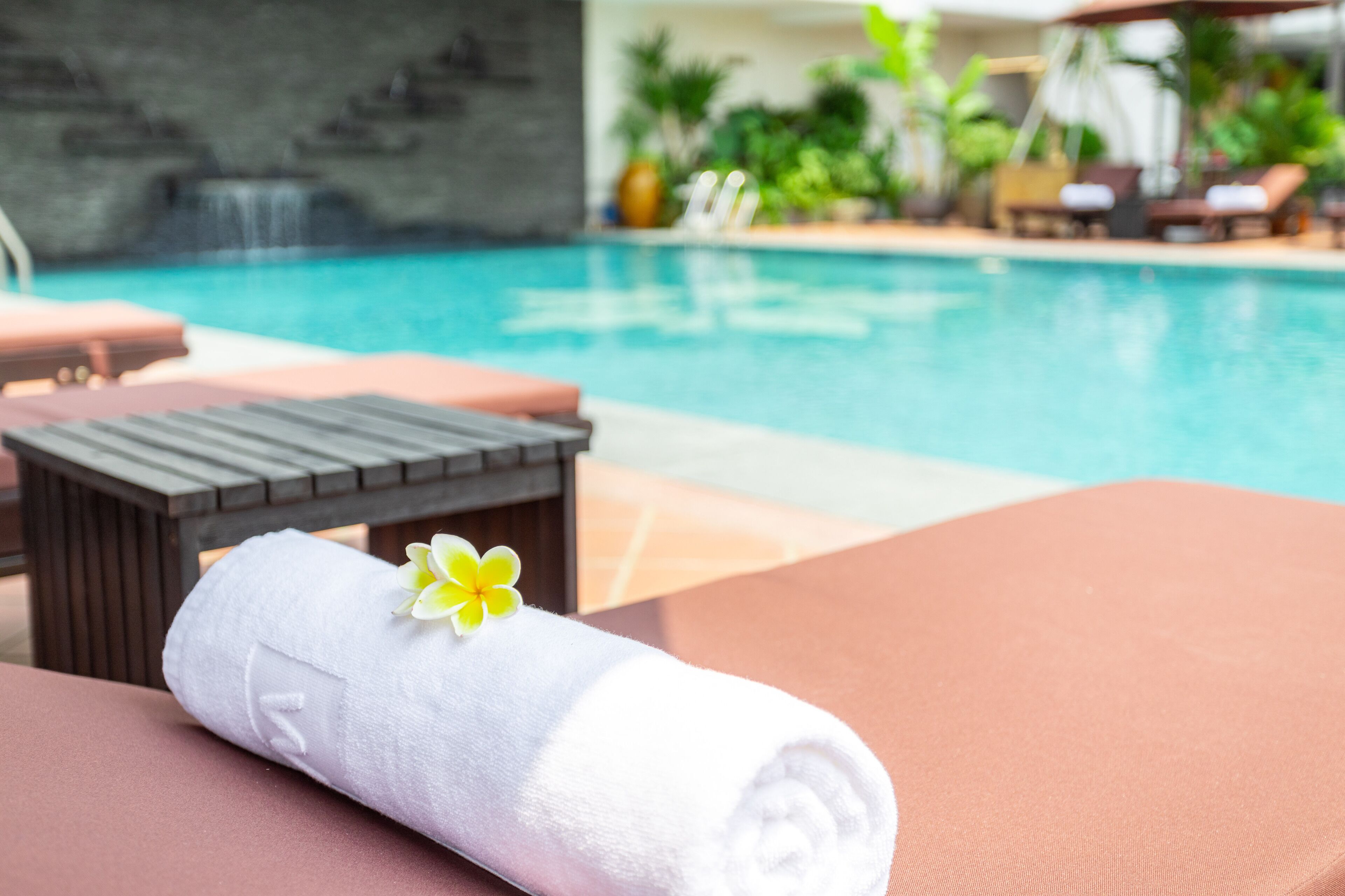 outdoor pool, open 6:00 am to 10:00 pm, pool umbrellas, pool loungers