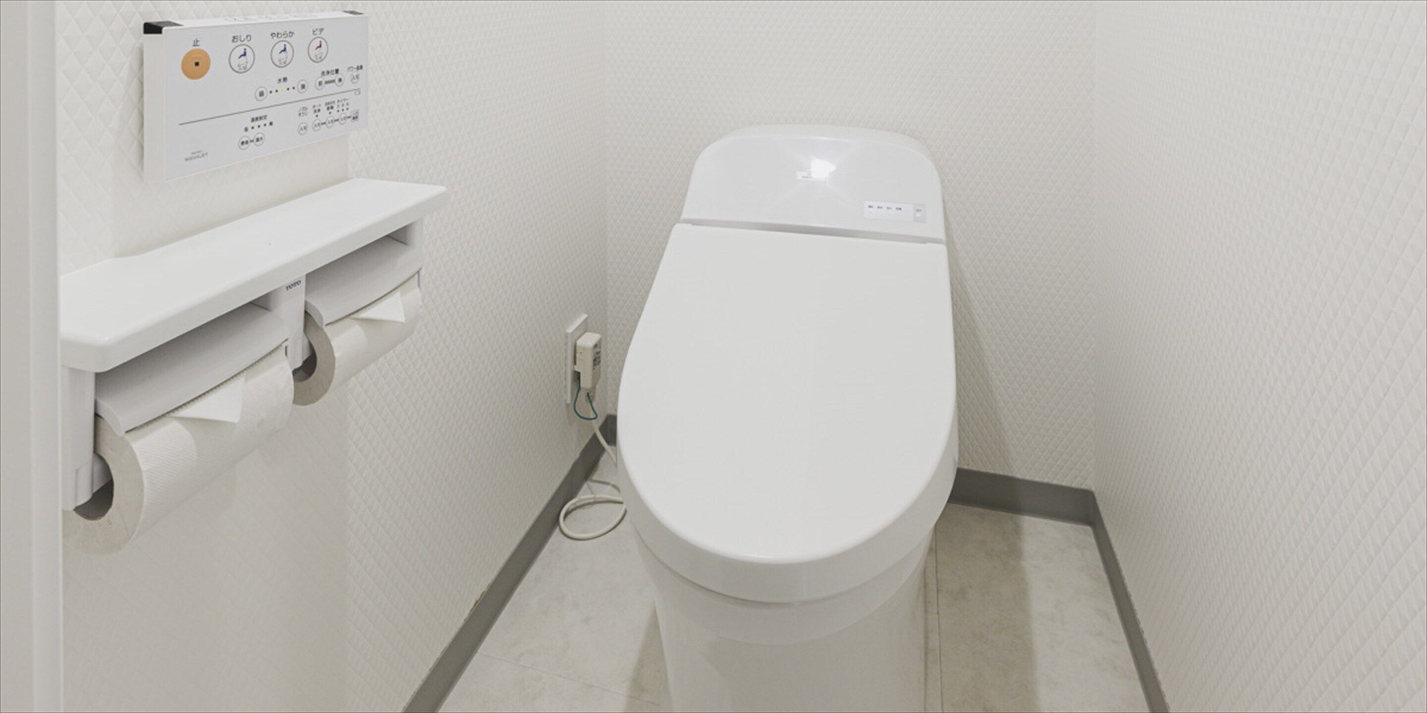 a deluxe | bathroom | free toiletries, hair dryer, slippers, towels