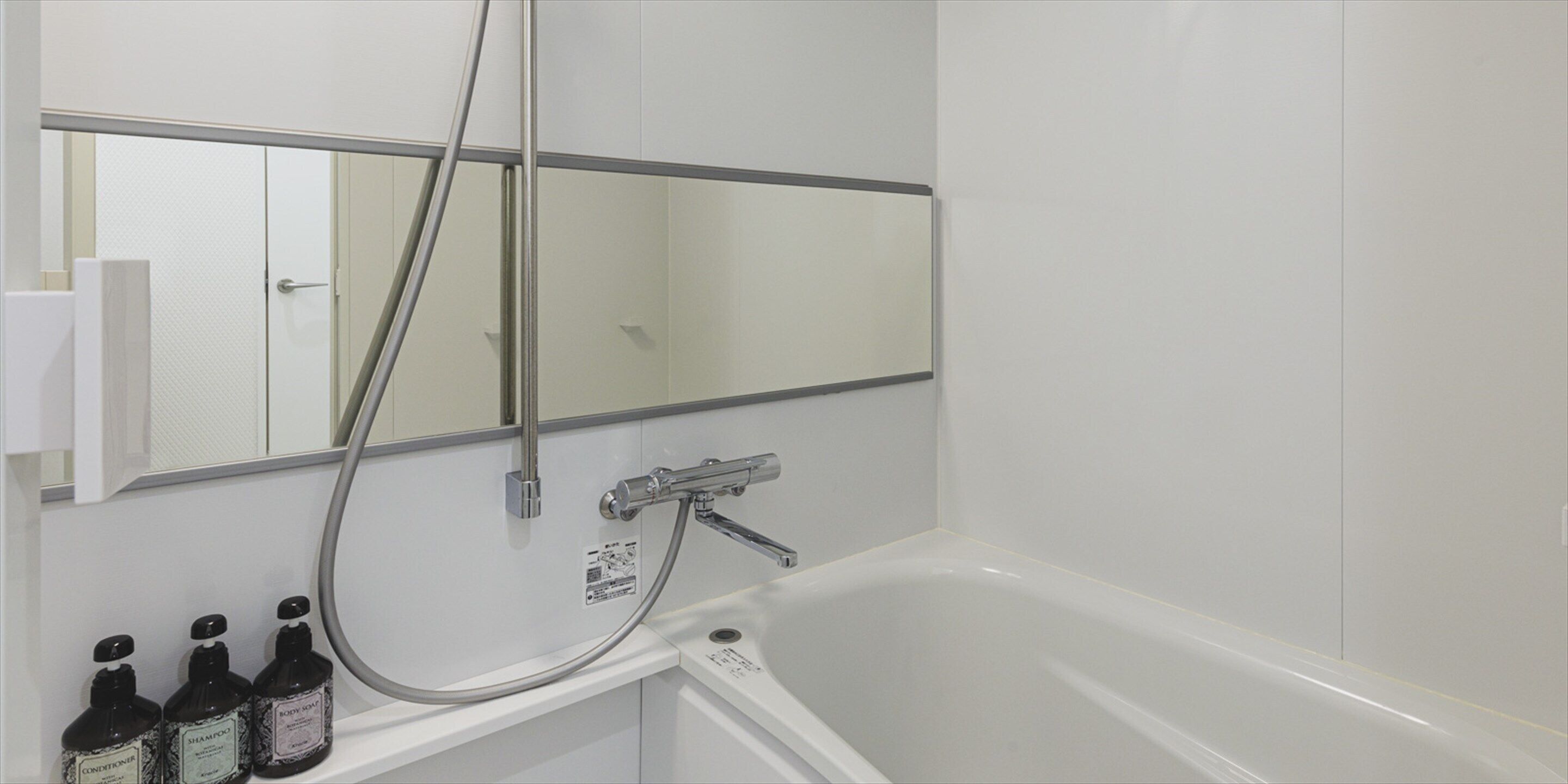 db family deluxe | bathroom | free toiletries, hair dryer, slippers, towels
