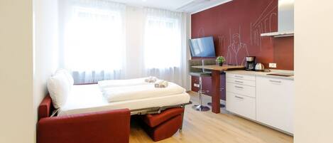 Tabla de planchar con plancha, wifi, ropa de cama