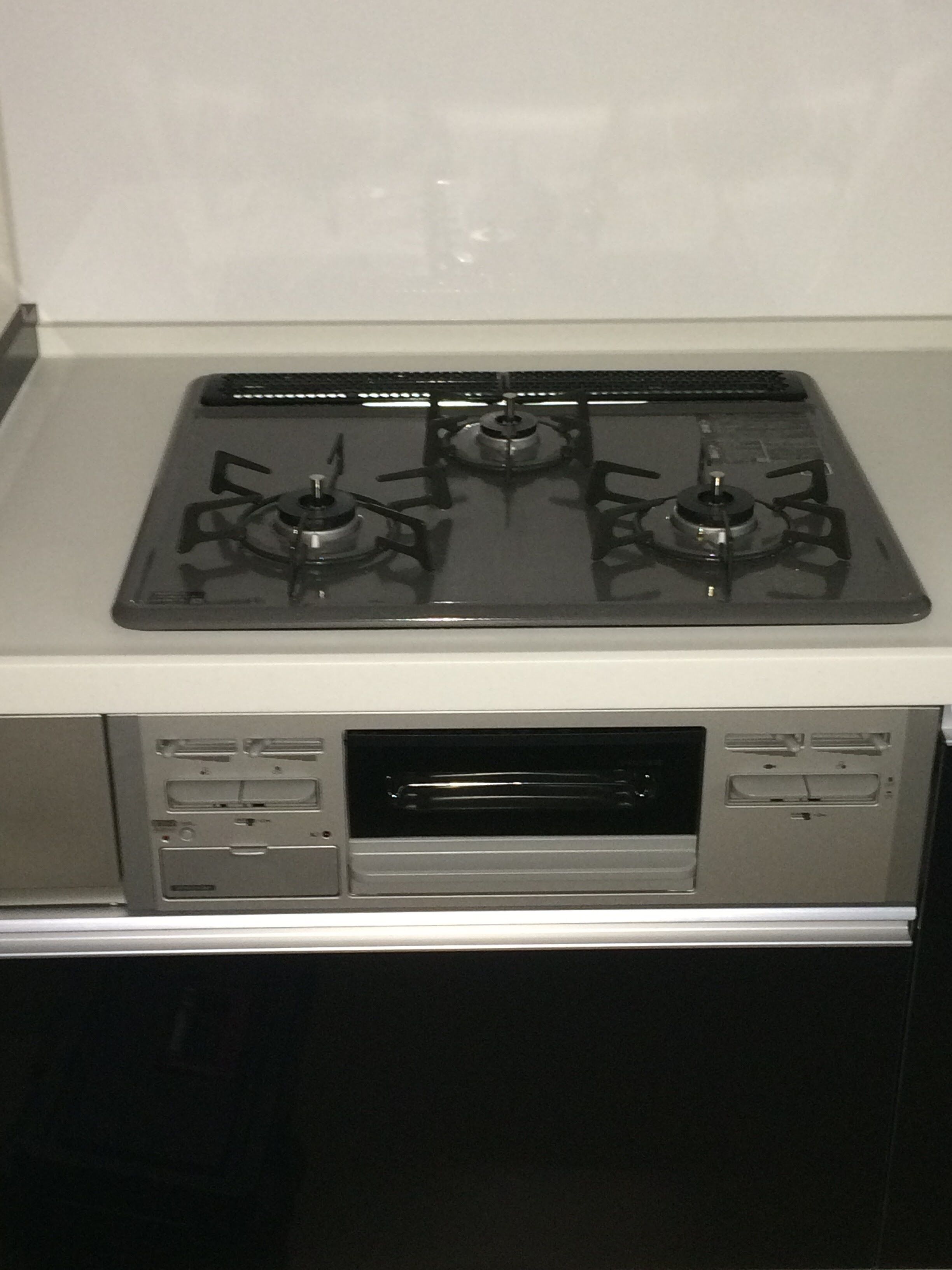 A kitchen with a stove, oven, and built-in microwave.