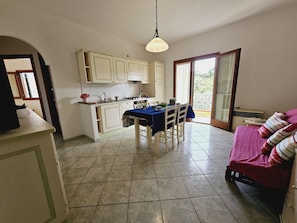 Comfort Apartment, 1 Bedroom, Balcony | Living area | TV - Le Residenze con Piscina (Santa Teresa di Gallura)