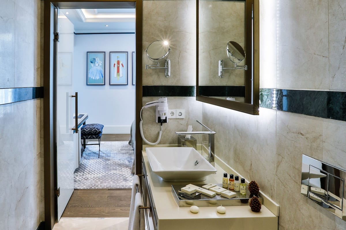 rainfall showerhead, designer toiletries, hair dryer, bathrobes