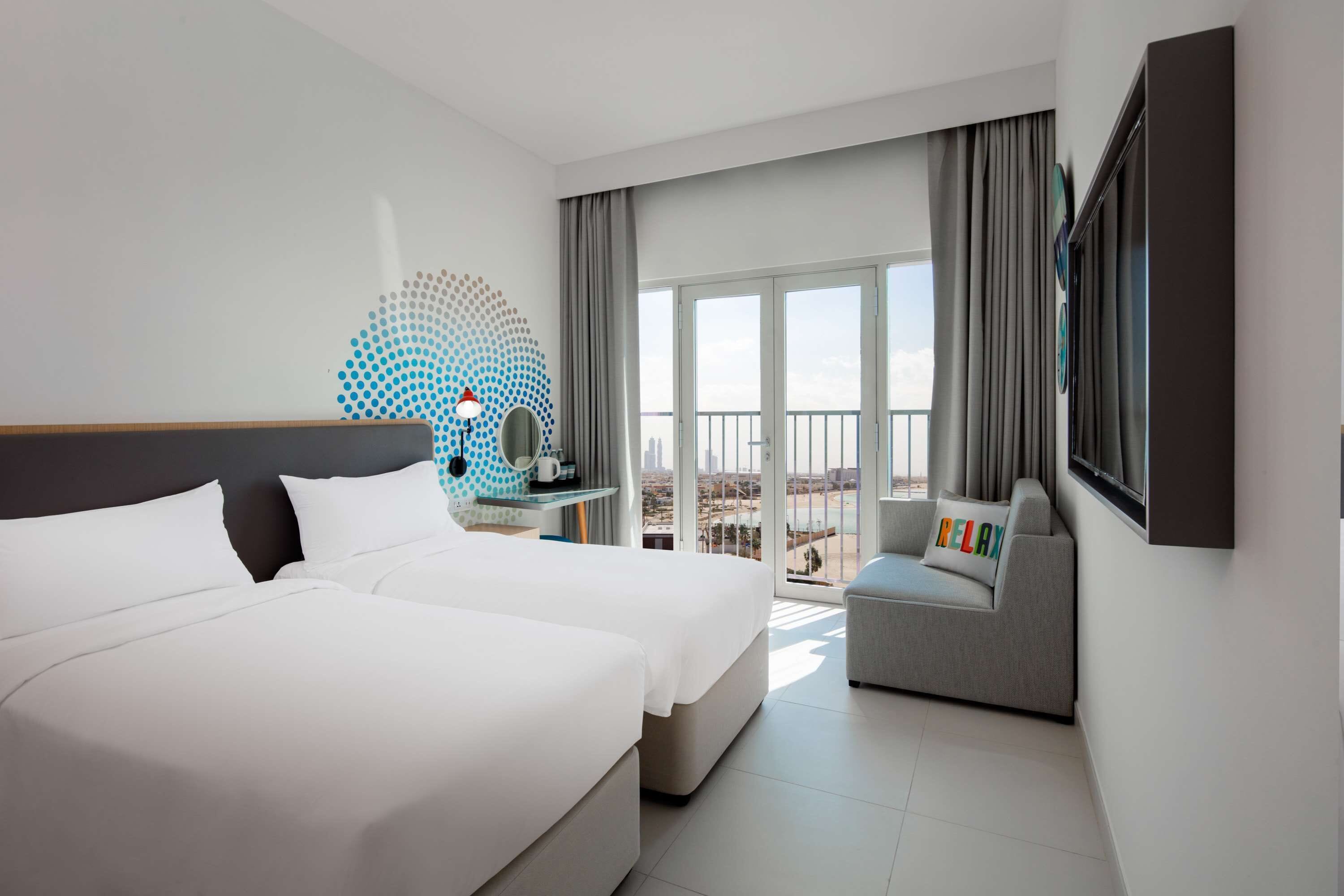rover room free shuttle service to dubai mall, private beach | in-room safe, desk, laptop workspace, blackout curtains