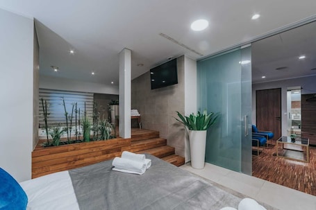 Luxury Apartment, 2 Bedrooms, Hot Tub | Living area | 60-inch flat-screen TV with satellite channels, TV, heated floors