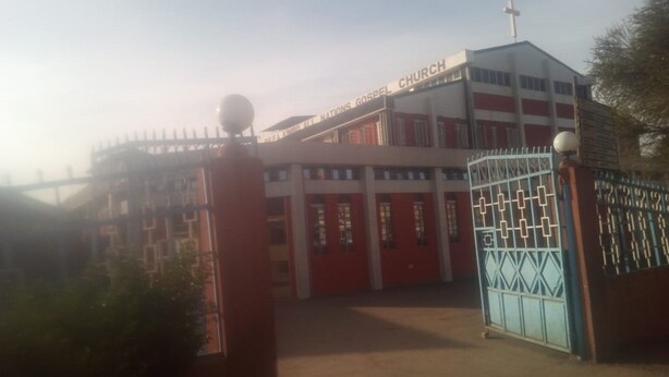 A building with a cross on top, labeled "Missions Gospel Church." - Kimbo Pefa Guest House (Ruiru)