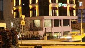 A multi-story hotel with a central courtyard, balconies, and a sign for 'McGarden'. - My Garden Hotel (Istanbul)