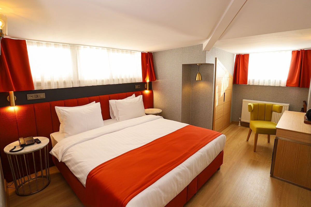 Economy Double Room | 2 bedrooms, minibar, in-room safe, individually decorated