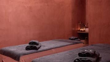 Experience a serene spa retreat with two massage tables and a calming ambiance.