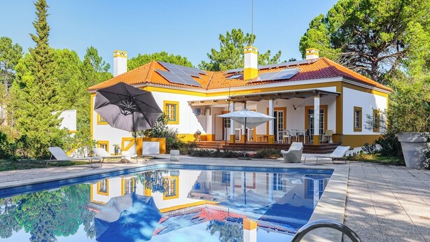 A house with a swimming pool, outdoor seating, and solar panels on the roof. - Villa 97 with private pool by Trip2Portugal (Alcácer do Sal)