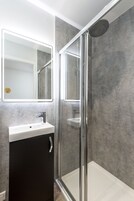 Shower, free toiletries, towels, soap