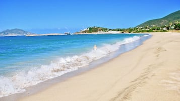 On the beach, sun loungers, beach towels