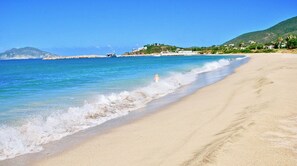 On the beach, sun-loungers, beach towels