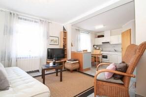 Apartment, 1 Bedroom (Huuske een) | Living area | Flat-screen TV