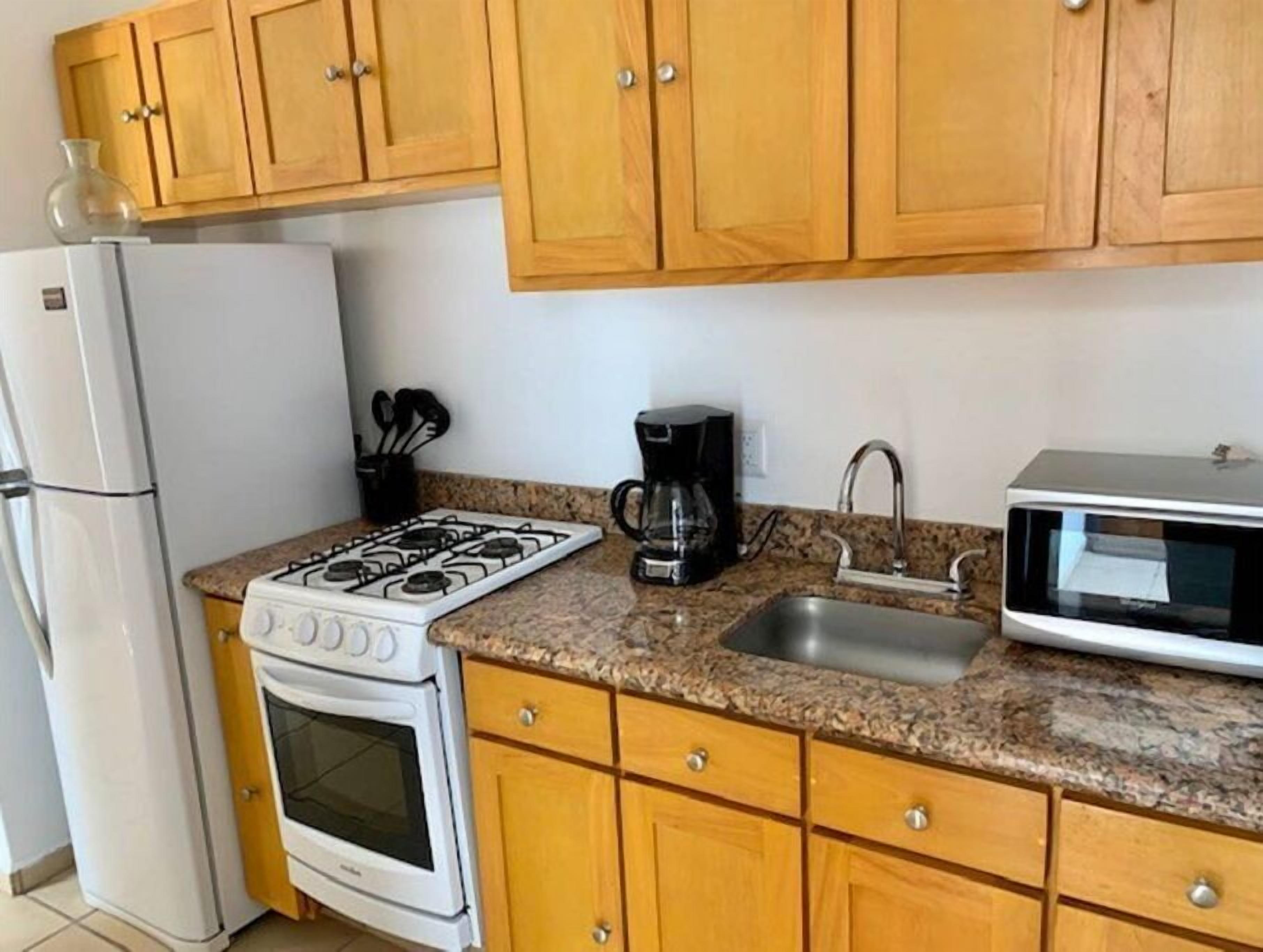 Fridge, microwave, toaster, cookware/dishes/utensils