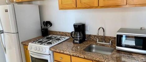 Fridge, microwave, toaster, cookware/dishes/utensils