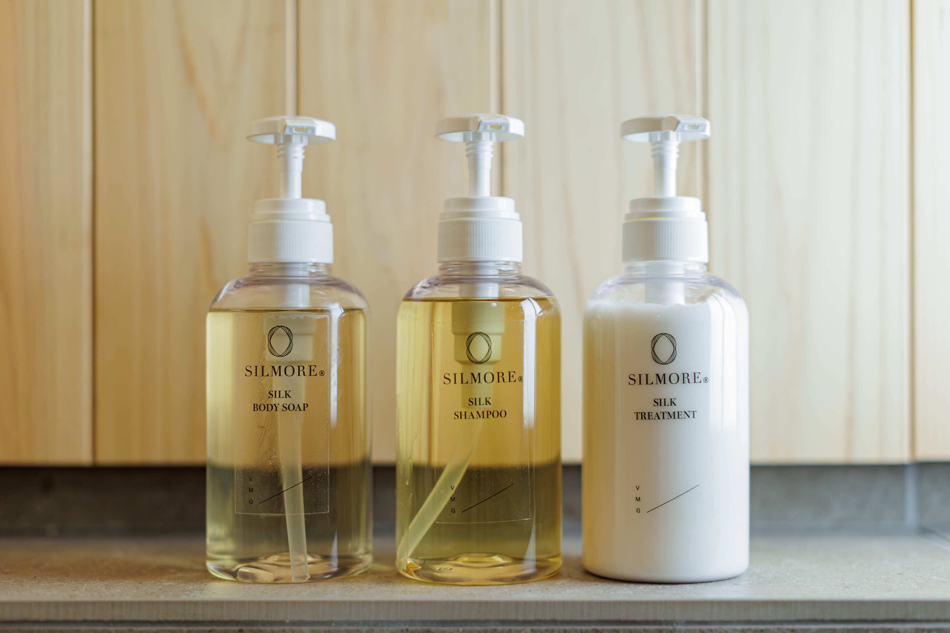 Three bottles of Silmore products on a countertop.