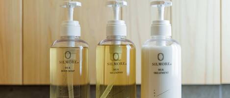 Three bottles of Silmore products on a countertop.