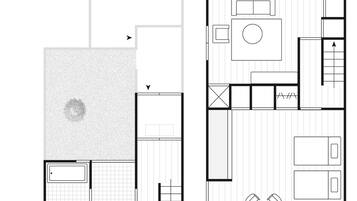 Plano de planta de una habitación de hotel con una amplia zona de estar, un comedor independiente y una kitchenette.